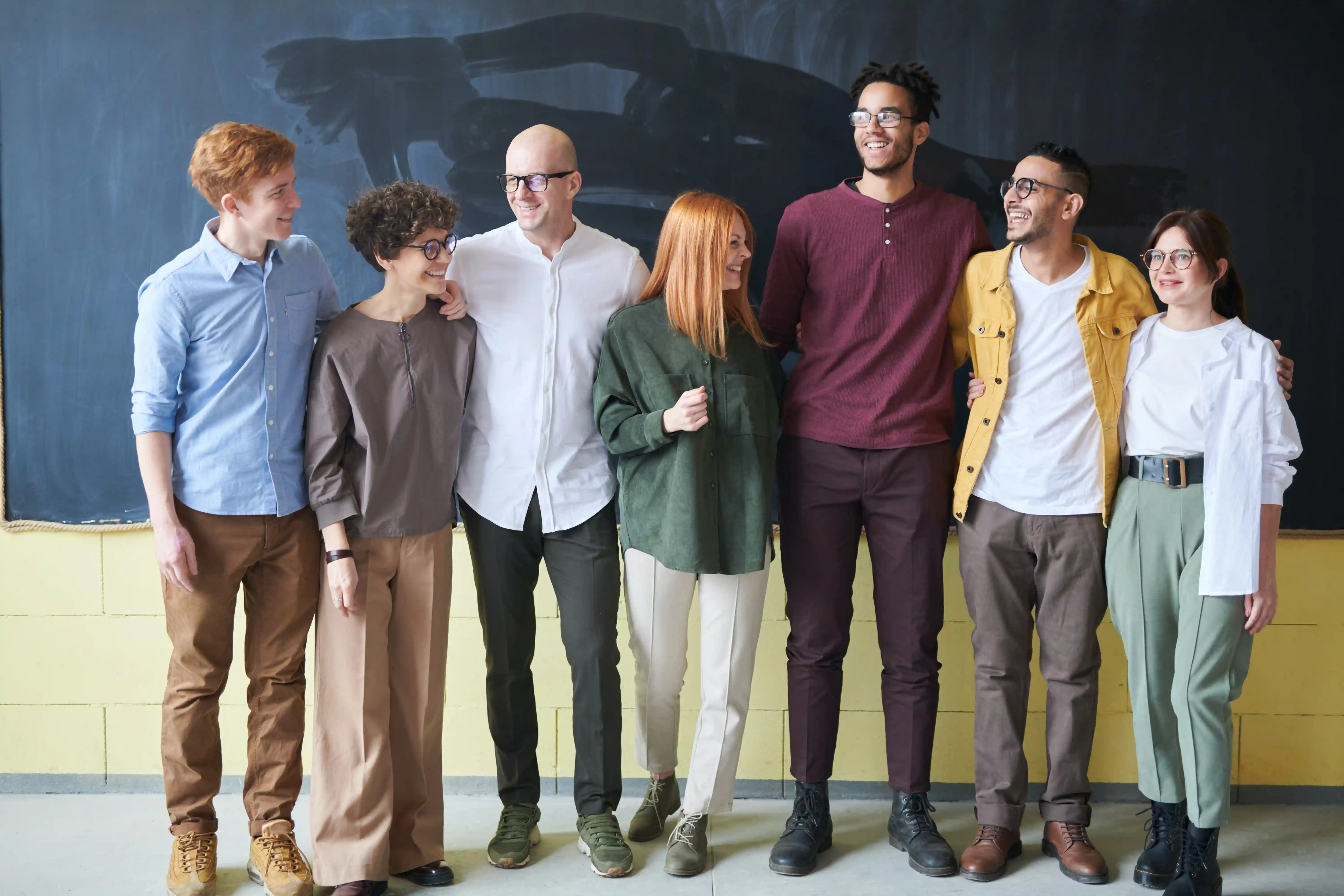 Employess are standing for a group image